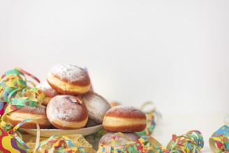 Colourful decoration and doughnuts, carnival table, copy room, white background