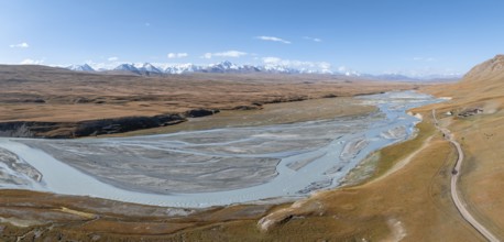 Aerial view, Burkhan mountain valley with meandering river, barren dramatic mountain landscape,