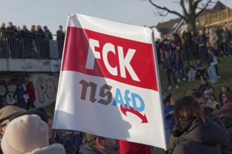 Banner with the inscription FCK AfD, large demonstration against right-wing extremism and AfD on 27