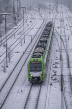 Winter weather, heavy snowfall, railway tracks in front of Essen main station, S-Bahn train, North