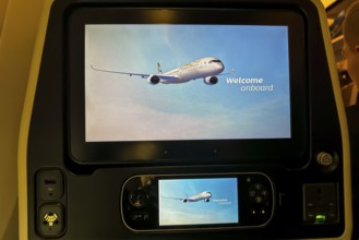 Aircraft of the airline Etihad, interior with monitor for the passenger with the text welcome