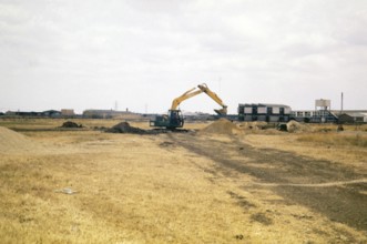 Mechanical excavation machinery, Cambridge University archaeological site called Great Shelford,