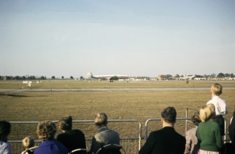 Aircraft spotters watching Lockheed Super Constellation aircraft on the runway, Heathrow Airport,