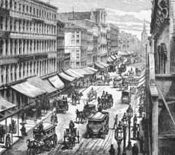 Horse-drawn carriages and carts on Broadway in New York, numerous shops with sun protection,