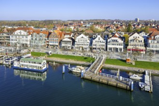 View over shops and restaurants along picturesque Vorderreihe at seaside resort Travemünde,