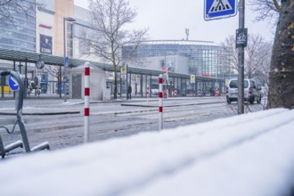 Snowy, empty bus stop in front of a modern building in the city, Sindelfingen, Germany, Europe