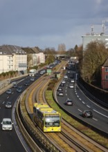 Essen, North Rhine-Westphalia, Germany - Cars and a public bus drive through Essen city centre on