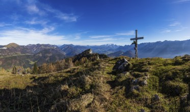 Drone shot, summit cross on the Schwarzer Berg with a view of the Lammertal with Dachstein massif