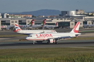 Lisbon, Portugal - September 2, 2023: Lauda Europe Airbus A320-214 passenger plane taxi on runway