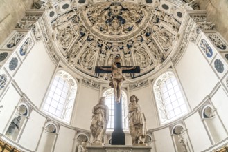 Crucifix and Baroque stucco work on the vault of the west choir in the interior of St Peter's