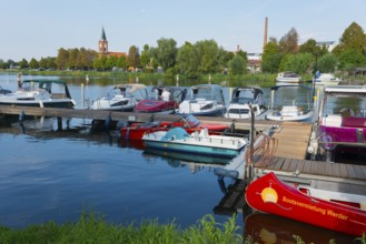 A harbour with several boats and a church in the background, Maria Meeresstern church, old town