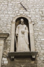 Religious statue in recess on outside wall of City Museum, Sibenik, Croatia, Europe