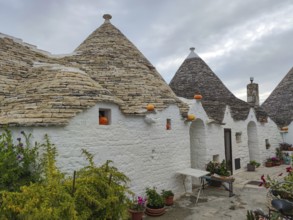 Trulli house decorated with pumpkins, Alberobello, UNESCO World Heritage Site, Apulia, Italy,