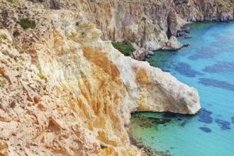 Multicoloured rock formations plunging into the sea, Firopotamos, Milos Island, Cyclades Islands,