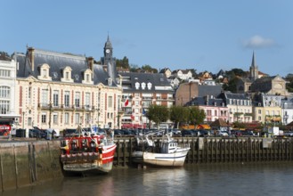 Historic harbour with fishing boats and church towers under a sunny sky, Trouville-sur-Mer,