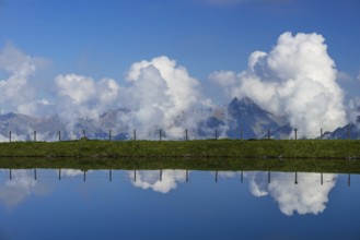 Artificial lake, snow pond, at the mountain station of the Kanzelwand cable car, panoramic view of