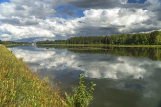 Clouds reflected in the Danube reservoir Faimingen, Lauingen Donau, Bavaria, Germany, Europe