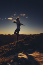 Trail running in autumn on the Jochberg on Lake Walchensee against the wonderful backdrop of the