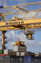 Duisburg, North Rhine-Westphalia, Germany, Containers are loaded onto a goods train at the port of