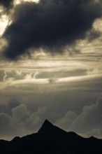 Summit in the morning light with dramatic clouds, Lech, Lechquellengebirge, Vorarlberg, Austria,