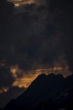 Summit in the morning light with dramatic clouds, Lech, Lechquellengebirge, Vorarlberg, Austria,