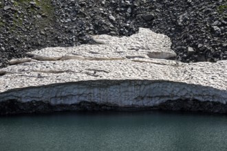 Remains of snow in Lake Sassolo, Lago di Sassolo, Sambuco Valley, Vale Sambuco, near Fusio,