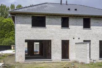 Construction phase of newly built house, new development semi-detached house