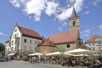 Gothic Ägidienkirche and street pub with people and parasols, Wenigemarkt, Erfurt, Thuringia,