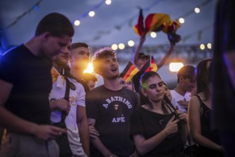 Scenes in the fan zone on Platz der Republik in front of the Reichstag building taken in Berlin, 29