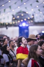 Scenes in the fan zone on Platz der Republik in front of the Reichstag building taken in Berlin, 29