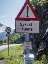 Warning system to show if cyclists are cycling in the next unlit tunnel, if button is pressed light