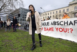 Luisa Neubauer speaks during a demonstration by Fridays for Future for compliance with climate