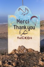 Paragliding sign in four languages Tamellalt, southern Morocco, north Africa