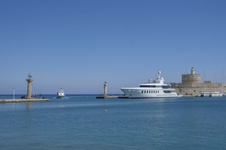 Elafos and Elafina, stag and hind, sculptures on columns, harbour entrance Mandraki harbour,