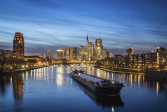 Skyline in the evening, skyscrapers of the banking district are reflected in the Main, Frankfurt am