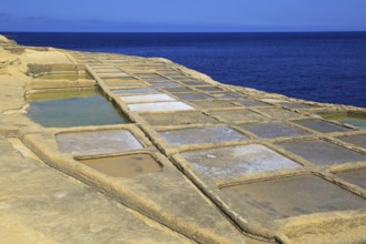 Historic ancient salt pans on coast near Marsalforn, island of Gozo, Malta, Europe