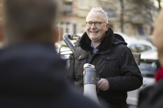 SPD parliamentary candidate Klaius Mindrup at a demonstration in Rykestraße against the decision of