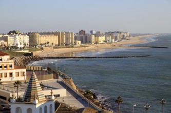 Coastal view east of sandy beaches and apartment housing, Cadiz, Spain, Europe