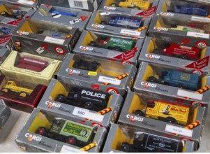 A selection of boxed Corgi model vehicles on display in auction room, UK