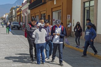 Oaxaca, Mexico, A health worker hands out free condoms as part of a fight against