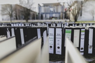 File folders stand in front of the Federal Chancellery as part of a protest action by the German