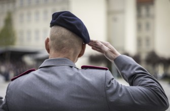 A soldier salutes during the final roll call at the Federal Ministry of Defence to mark the