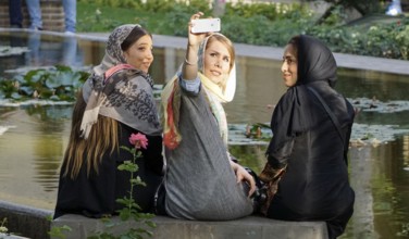 Three young Iranian woman take a selfie photo of themselves, Tehran, 22/05/2016