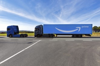 Blue truck with Amazon Prime logo parked on the roadside, PAD2 logistics centre, Amazon.com, online