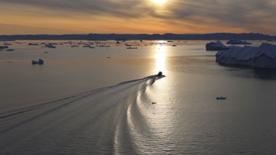 Iceberg seen from cruise ship vacation near Greenland coast in Arctic circle near Ilulissat Disko