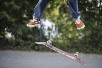 A person does a kickflip on a skateboard in Berlin, 16/08/2024