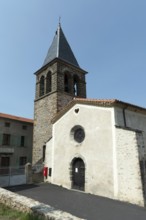 Saint-Roch Church under a clear blue sky in Aubazat village, Haute-Loire, Auvergne-Rhone-Alpes,