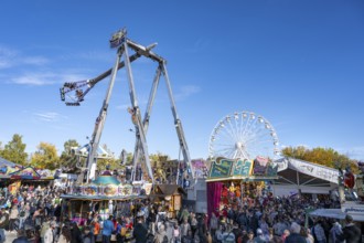 Crowd of people on fairground, amusement park, amusement ride, Ferris wheel, showmen, on the