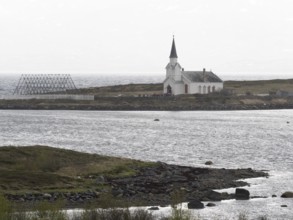 Nesseby town church, with congregation standing outside on Whit Sunday, May, Varanger Fjord,