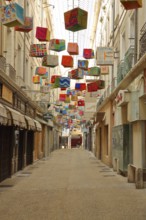 Narrow empty passage Boyer and decoration with colourful parcels, packages, inscription,